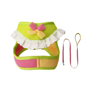 Lime green and pink mesh dog harness and matching leash with a yellow bow and white lace ruffle trim.