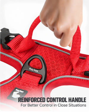 Close-up of the reinforced control handle on a red reflective dog harness for better control at close range