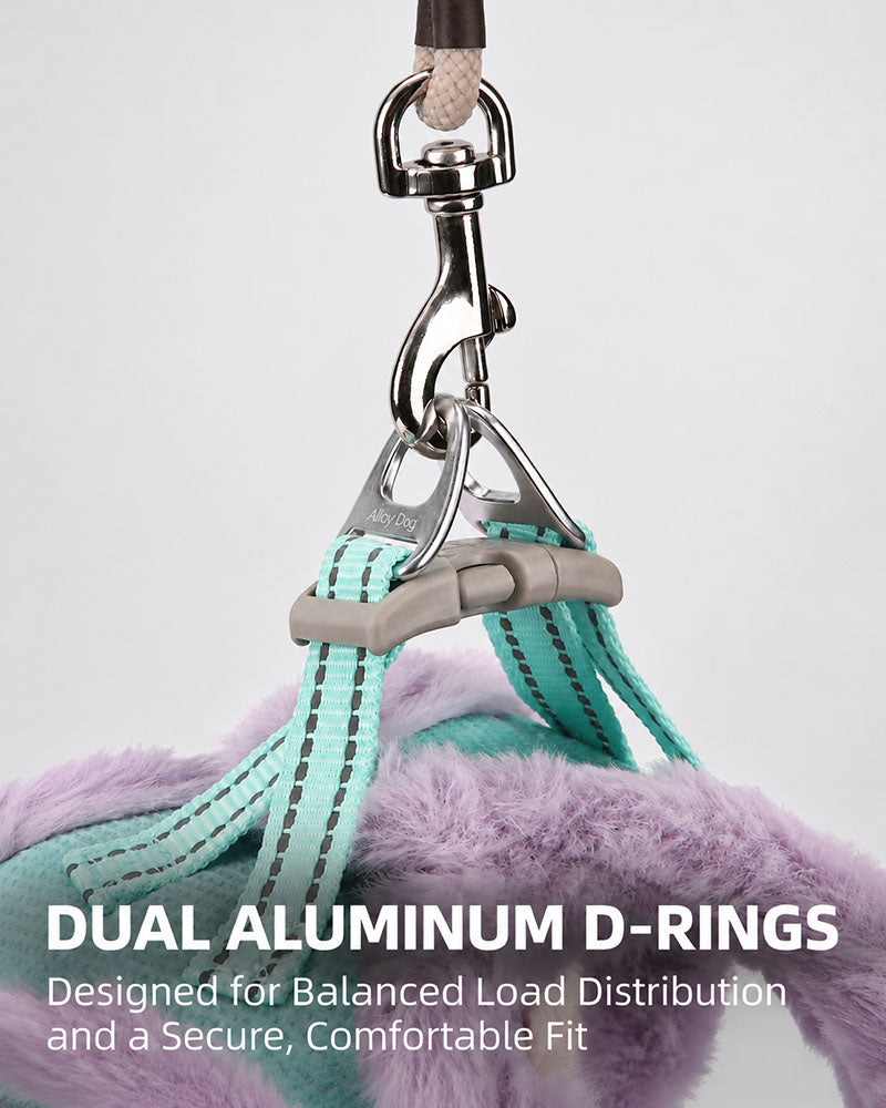 Close-up of dual aluminum D-rings on a Mint Turquoise and Lilac dog harness, showing the leash attachment hardware and reinforced webbing.
